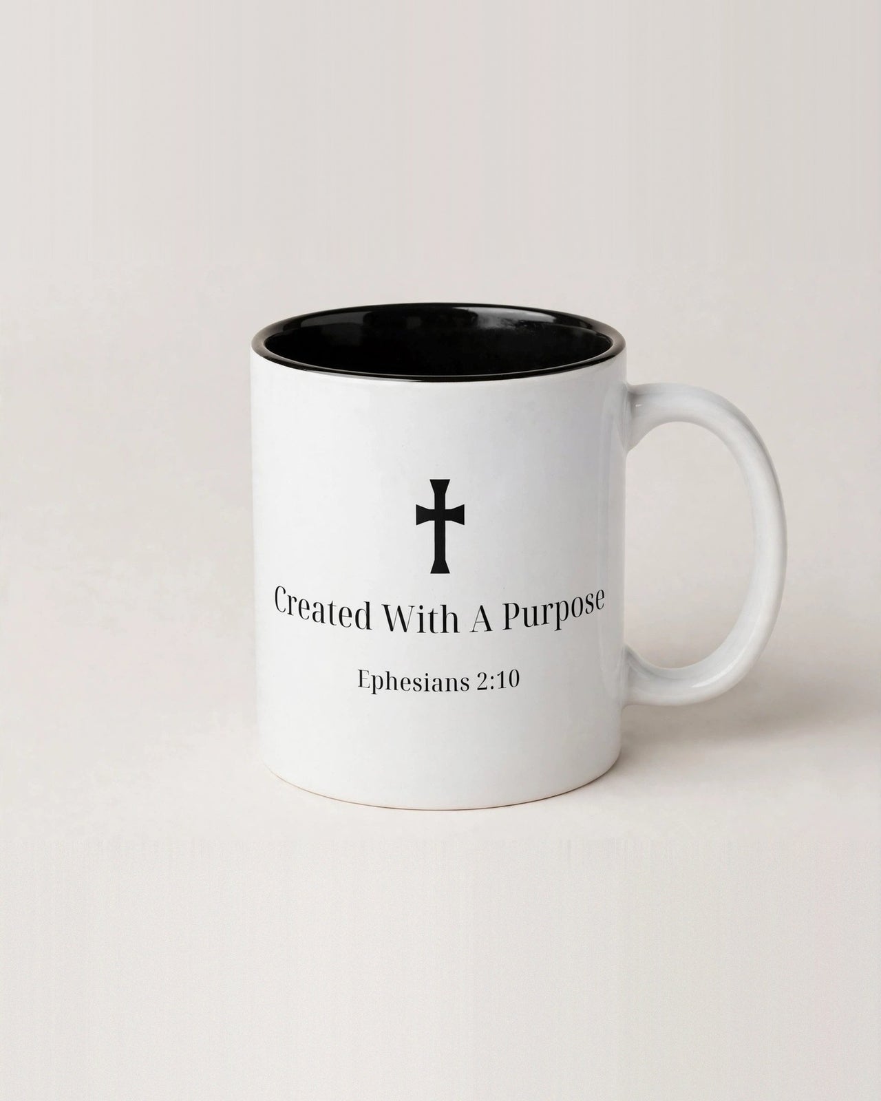 White ceramic mug with black interior and Created With A Purpose Ephesians 2:10 design - Christian coffee mug