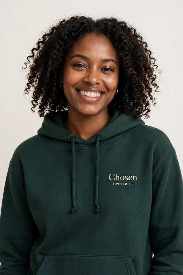 Woman wearing the Chosen hoodie in dark green