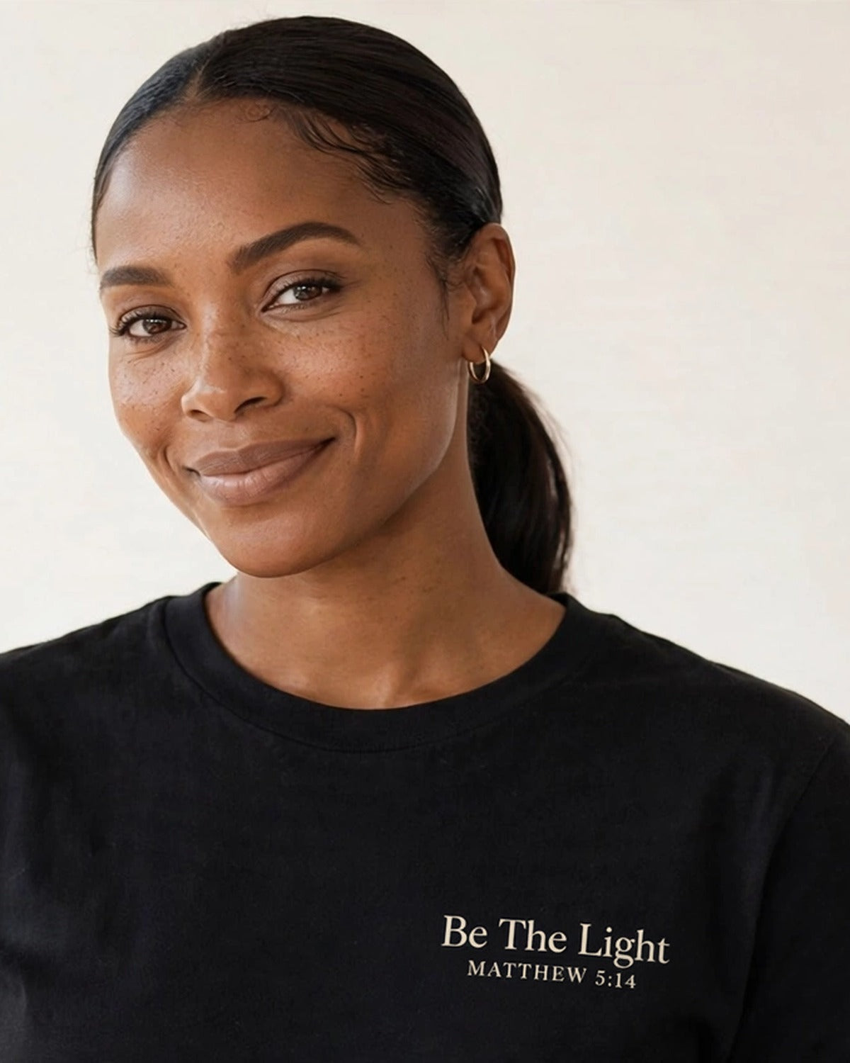 Be The Light tee in black, small left-chest print