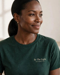 Thumbnail for Be The Light tee in dark green, small left-chest print