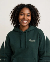 Thumbnail for Woman wearing the Chosen hoodie in dark green