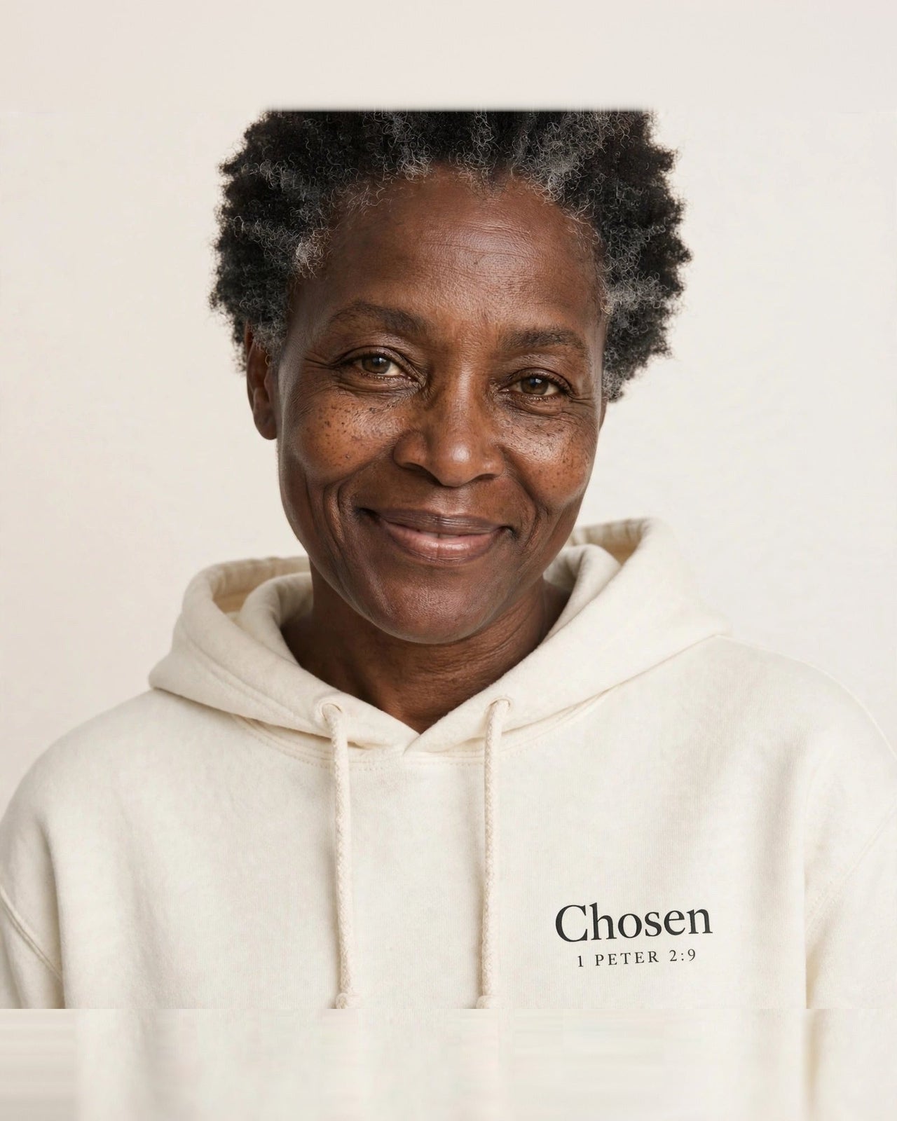 Woman wearing the Chosen hoodie in cream