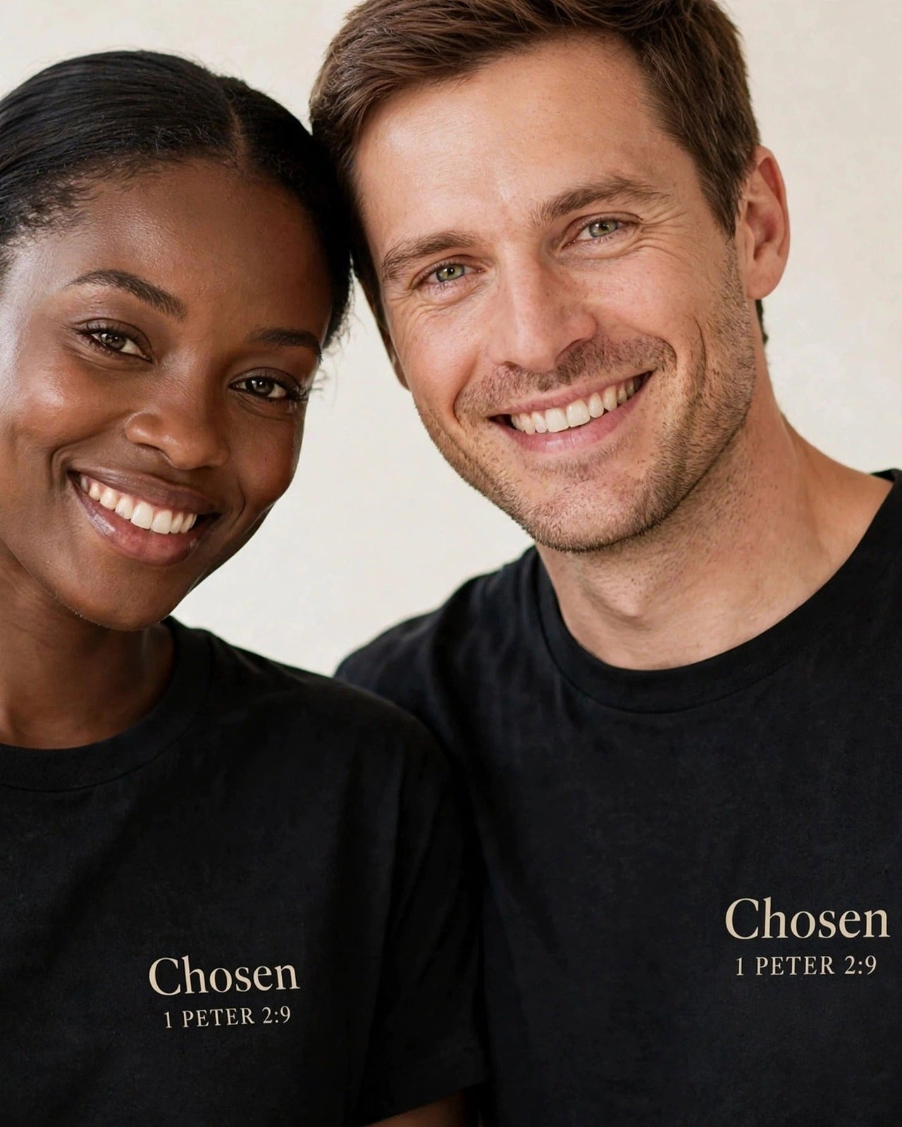 Couple wearing matching Chosen tees in black
