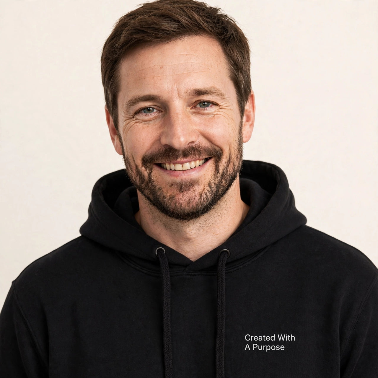 Man wearing the Created With A Purpose hoodie in black