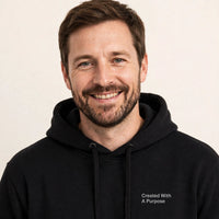 Thumbnail for Man wearing the Created With A Purpose hoodie in black