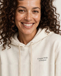 Thumbnail for Woman wearing the Created With A Purpose hoodie in cream