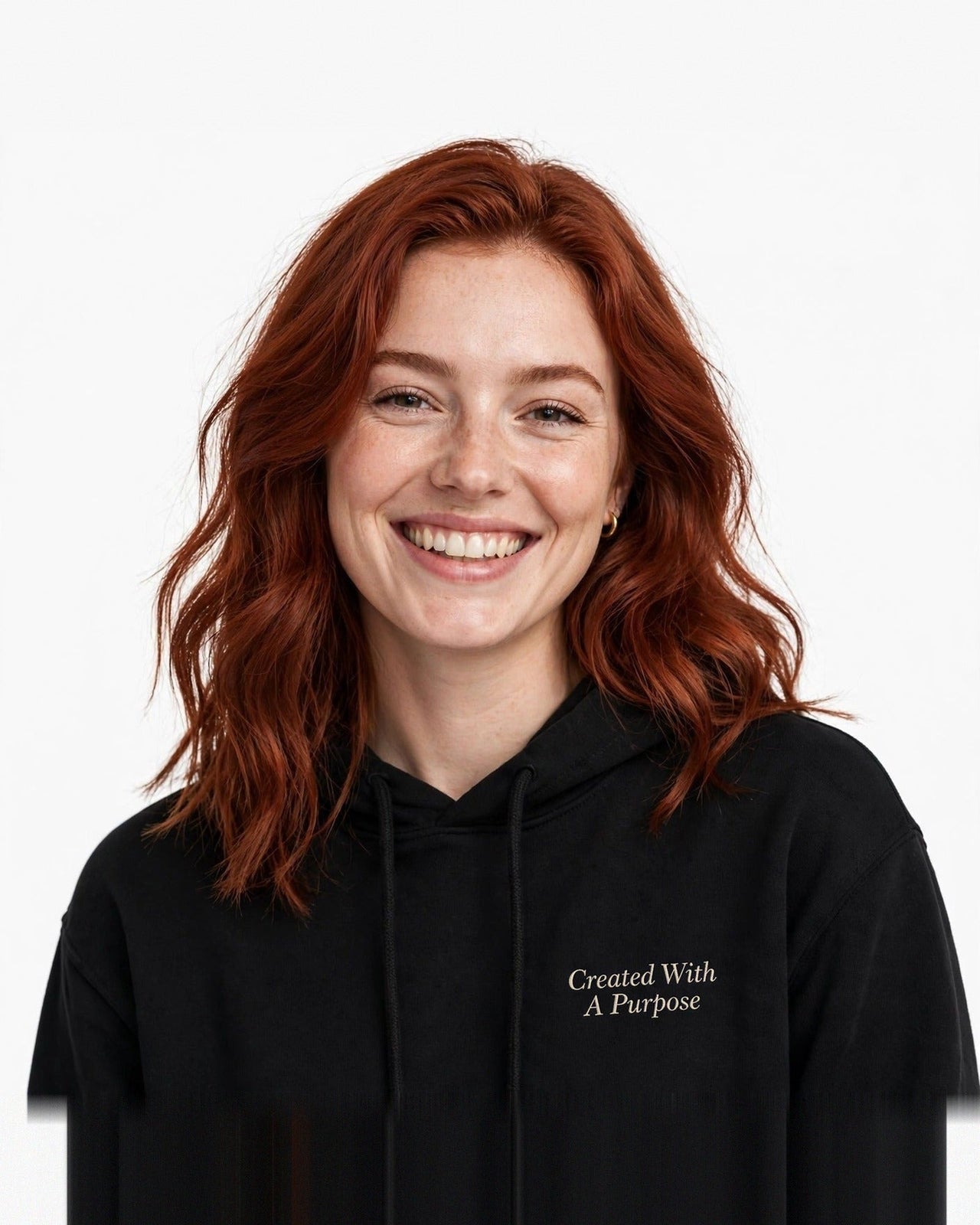 Woman wearing the Created With A Purpose hoodie in black