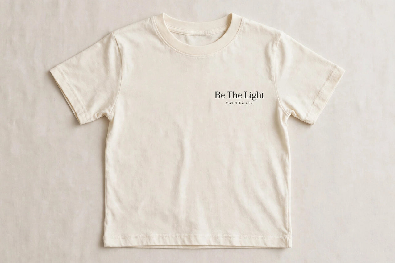 Black kids t-shirt with cream Be The Light Matthew 5:14 print on left chest - Christian kids shirt