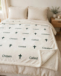 Thumbnail for Sherpa fleece blanket spread across a bed, white with a fine green cross and word print