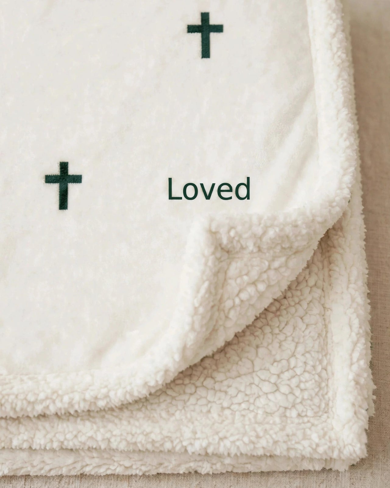 Close-up of the blanket print and fluffy sherpa pile texture