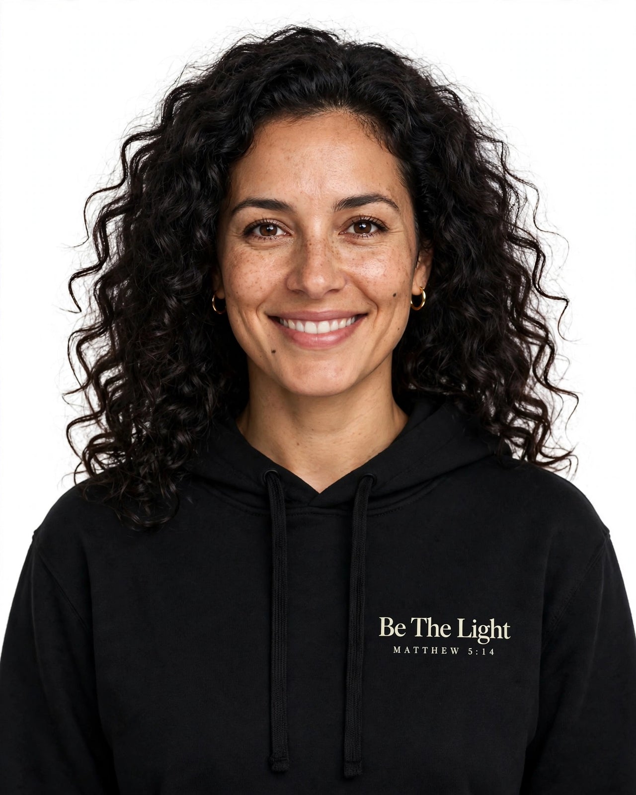 Woman wearing the Be The Light hoodie in black
