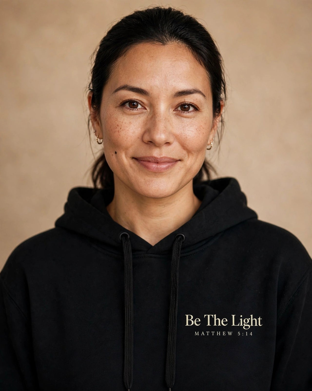Be The Light hoodie in black, small left-chest print