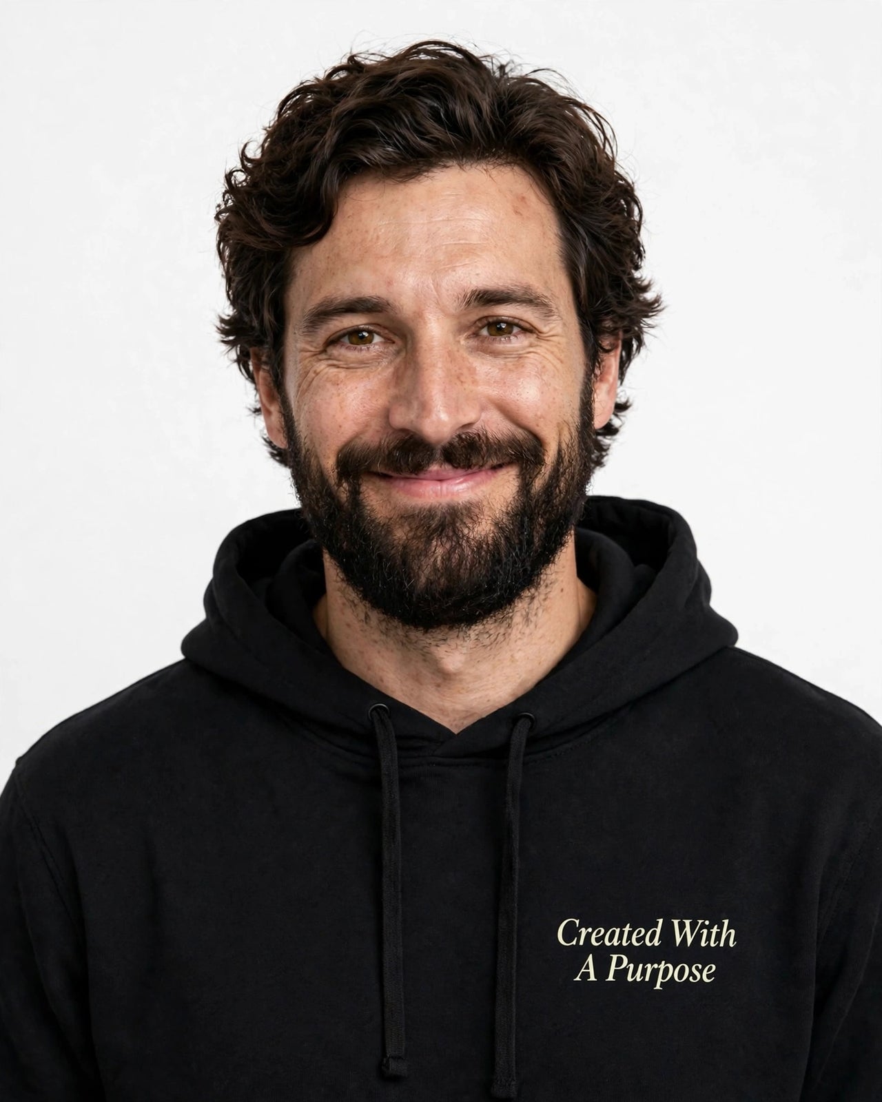 Man wearing the Created With A Purpose hoodie in black
