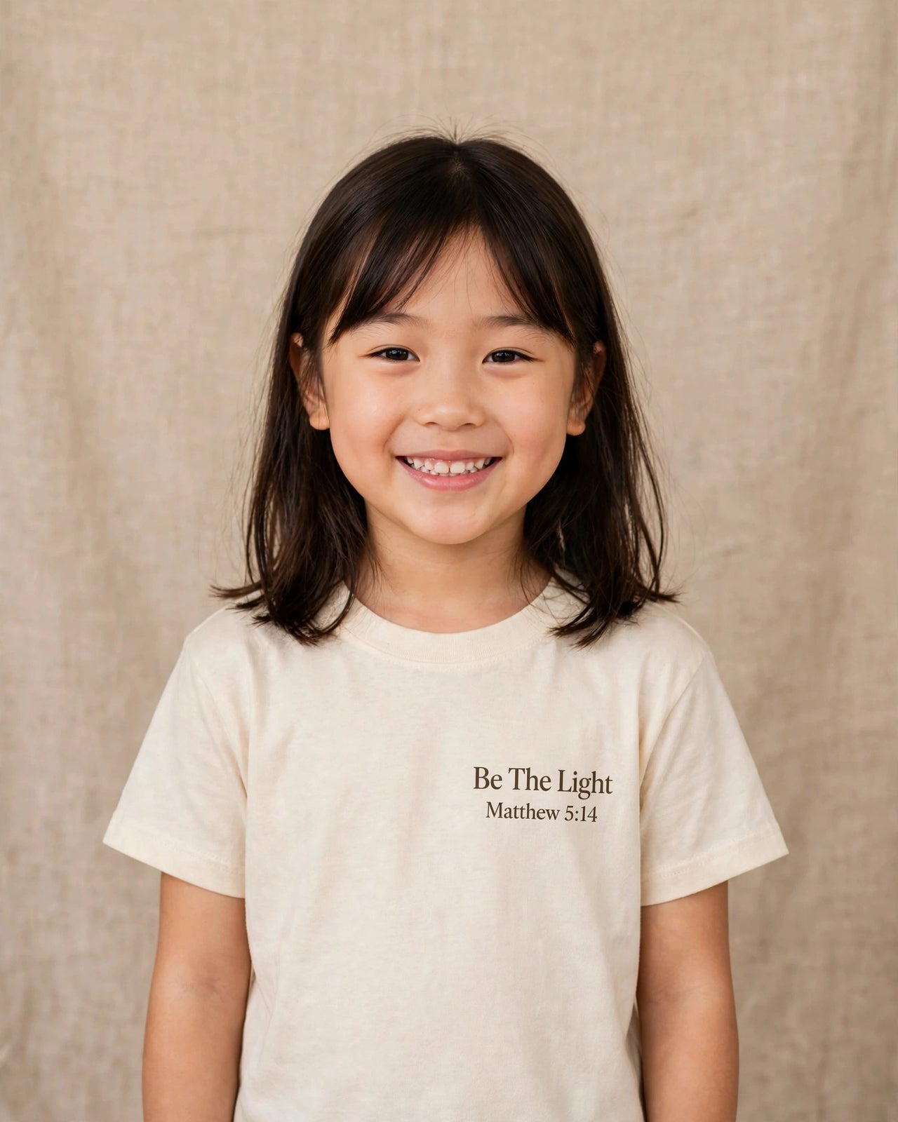 Kids tee mockup — Be The Light, Cream