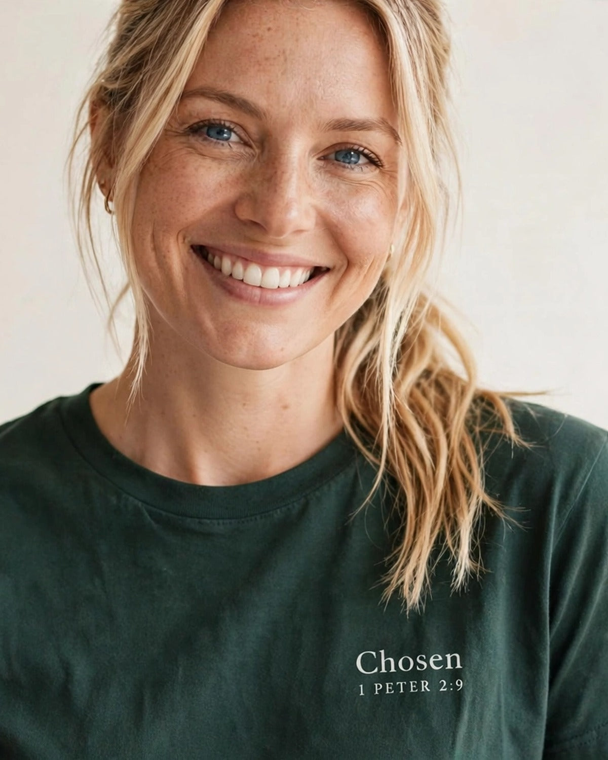 Woman wearing the Chosen tee in dark green