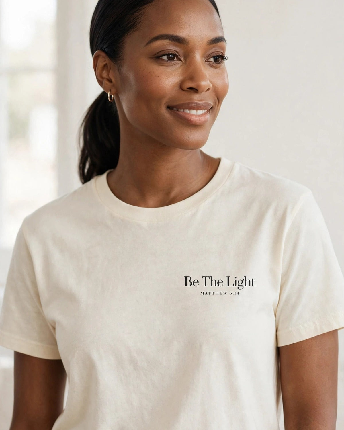 Be The Light tee in cream, small left-chest print