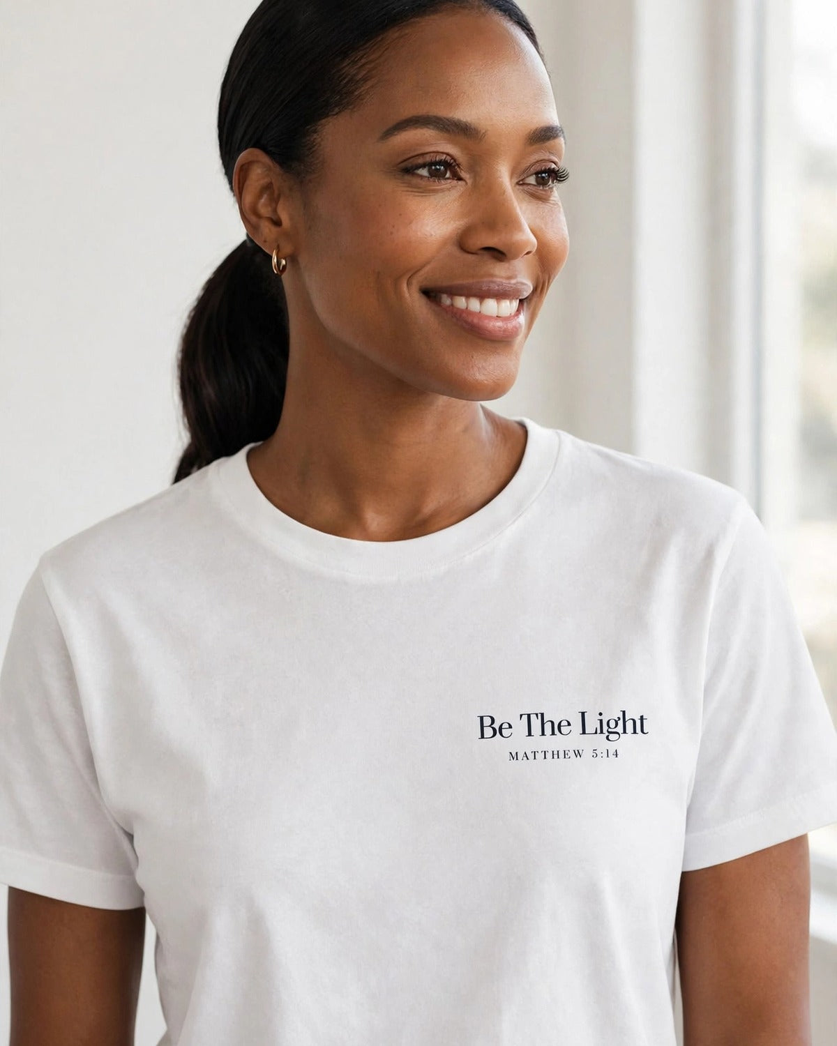 Be The Light tee in white, small left-chest print