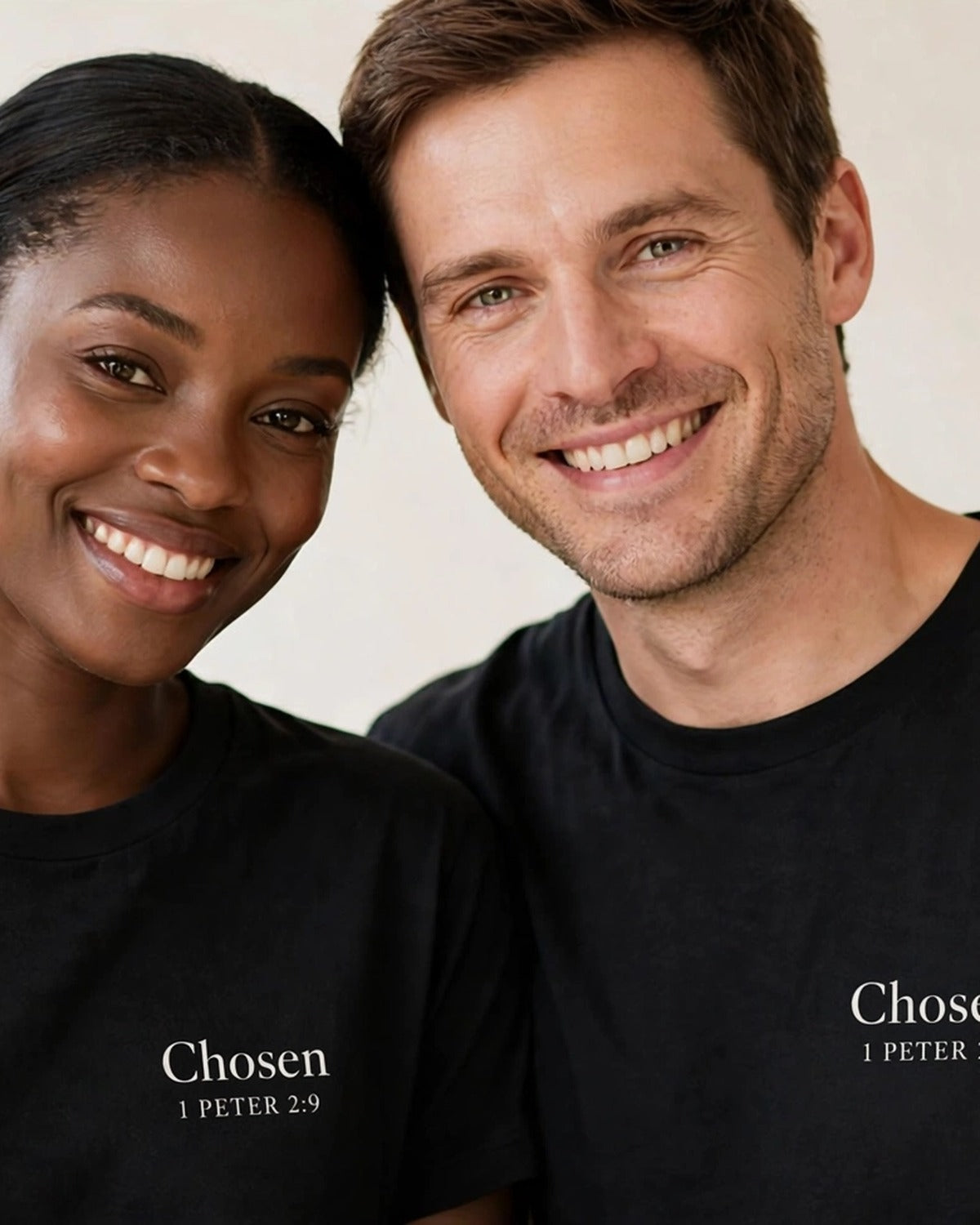 Couple wearing matching Chosen tees in black